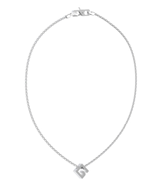 Silver Guess Jewellery necklace elegantly displayed at a slight angle against a clean white backdrop, showcasing its refined design.